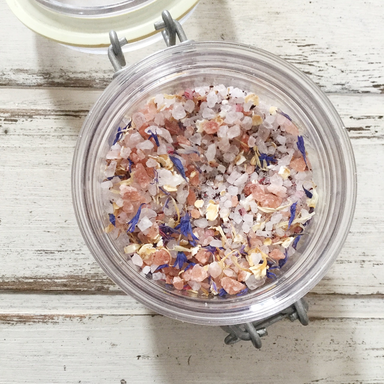 Pink botanical bath soaks in glass jar