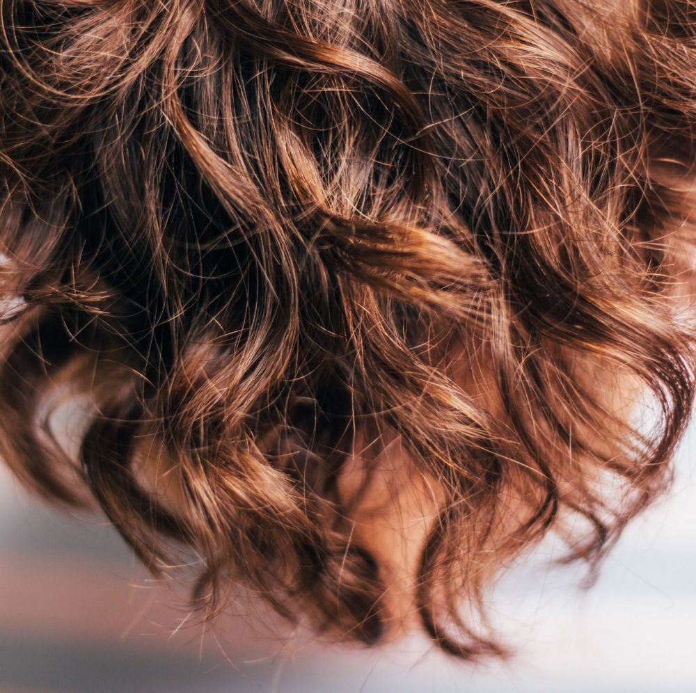 Curly brown hair