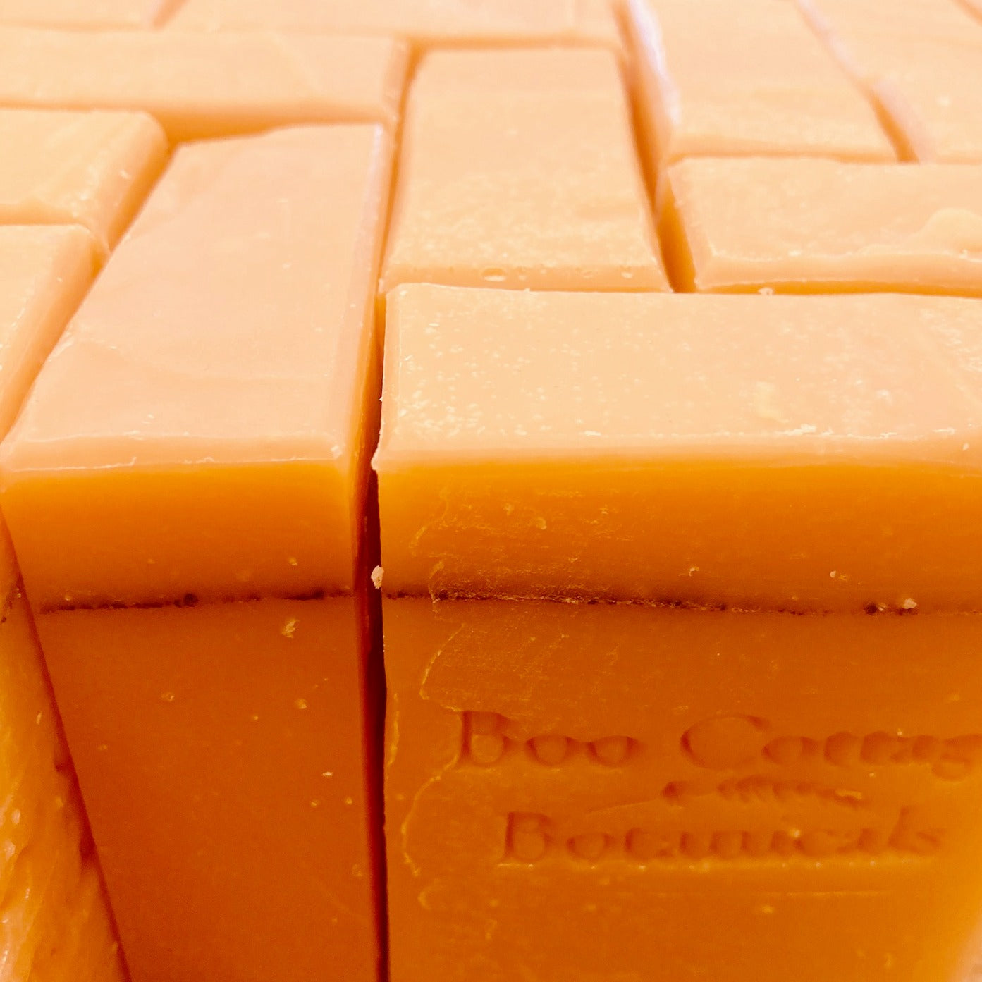 Group of orange soaps with nutmeg pencil line through the bars