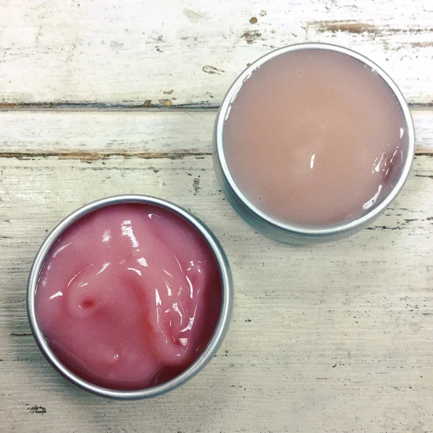 Pink and pale berry natural skincare balms in tins on rustic wood, Boo Cottage Botanicals