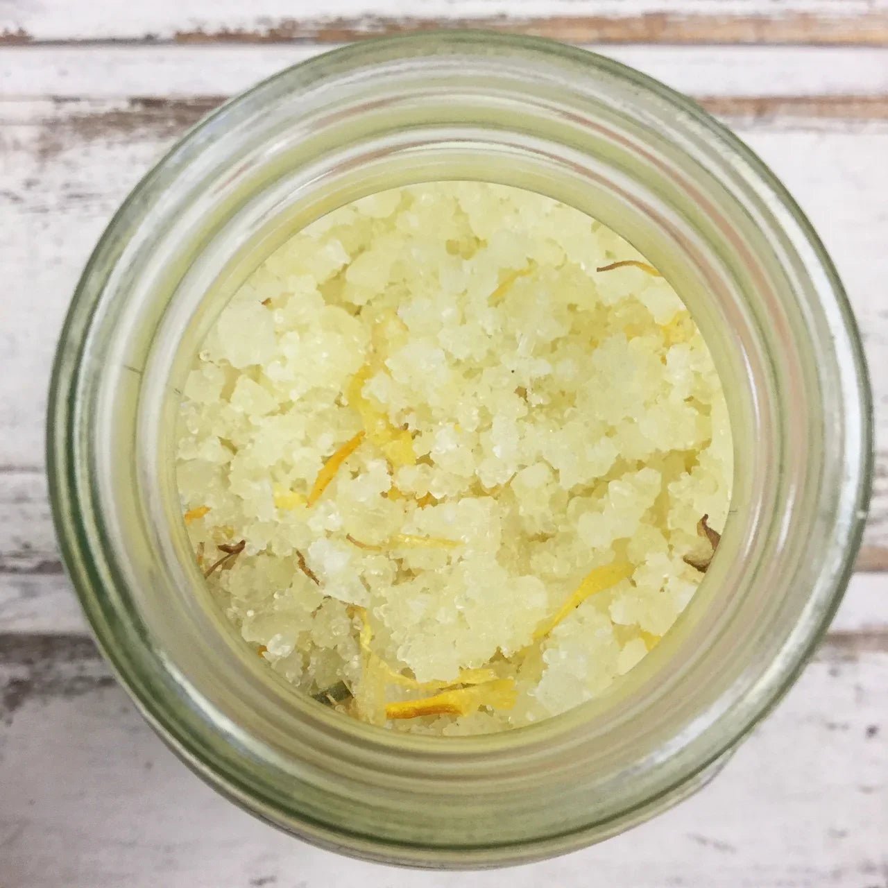 Close-up of natural botanical CALM bath soak with yellow petals in a glass jar, Boo Cottage Botanicals