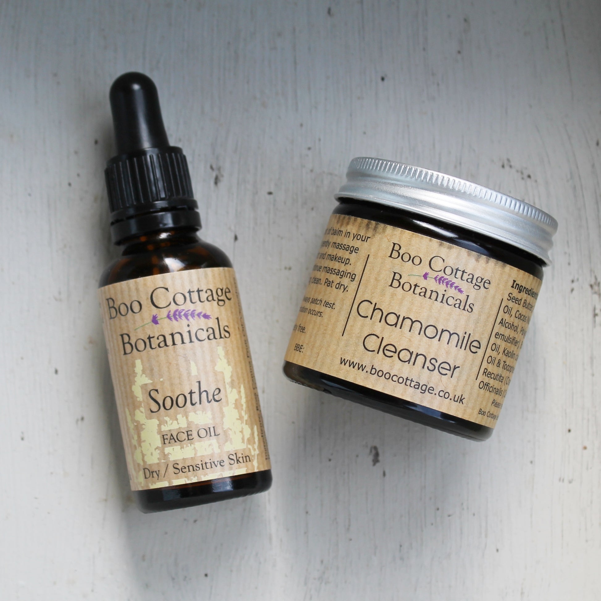 Soothe face oil and Chamomile cleanser in amber bottle and jar on white painted background