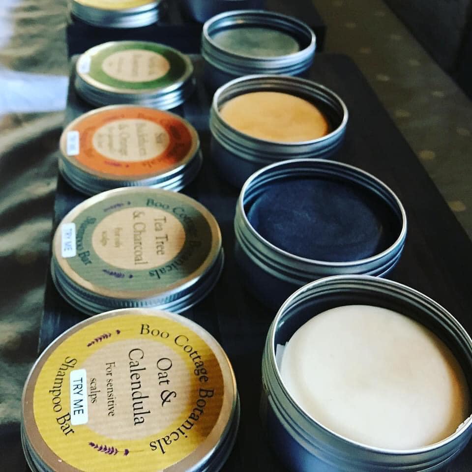 Open tins of shampoo bar testers