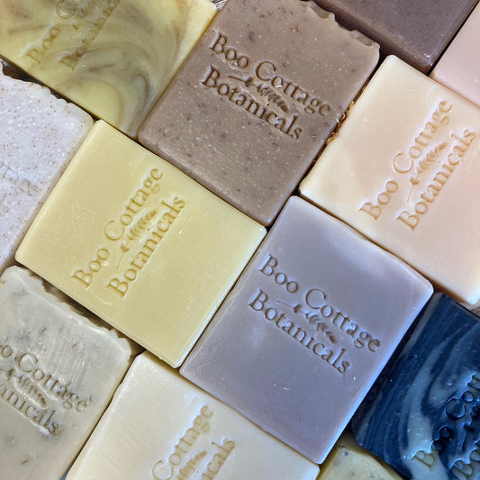 Rectangular natural soaps with Boo Cottage Botanicals logo of all different colours