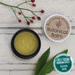 Cream balm in amber jar with plantain leaves and rosehips with Free From Skincare Awards logo