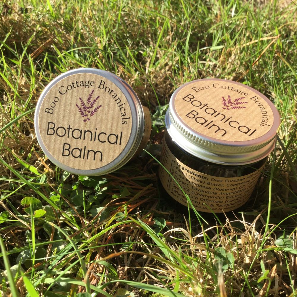2 jars of Botanical Balm in grass
